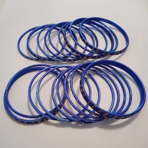 #486.  24 Piece Blue & Gold Bangle Bracelets. Size: 6